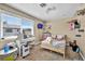 Bedroom featuring a window, playful decor, and a desk, perfect for relaxation and productivity at 266 Cordero Dr, Henderson, NV 89074