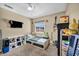 Cozy bedroom with a window, fan and functional furniture at 266 Cordero Dr, Henderson, NV 89074