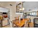 Cozy dining area with a wooden table, upholstered chairs, and open access to the living area at 266 Cordero Dr, Henderson, NV 89074