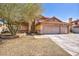 Charming home featuring a terracotta roof, a two-car garage, and desert-friendly landscaping at 266 Cordero Dr, Henderson, NV 89074