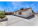 Backyard with a large concrete patio, mature landscaping, and a covered seating area at 2803 Marathon Dr, Henderson, NV 89074
