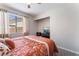 Cozy bedroom offering comfortable bedding, natural light, and a sleek TV for relaxed viewing at 2803 Marathon Dr, Henderson, NV 89074