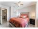 Inviting bedroom showcases a comfortable bed with decorative pillows, a nightstand, and fresh white paint at 2803 Marathon Dr, Henderson, NV 89074