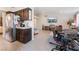 Open-concept kitchen and living area with stainless steel appliances, and an adjacent living space at 2803 Marathon Dr, Henderson, NV 89074