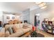 Open concept living room featuring laminate floors and access to dining room and kitchen at 2803 Marathon Dr, Henderson, NV 89074