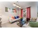 Cozy living room featuring neutral colored decor and an oversized window at 2803 Marathon Dr, Henderson, NV 89074