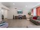 Bright living room featuring wood floors, neutral walls, and a comfortable gray sofa at 2803 Marathon Dr, Henderson, NV 89074