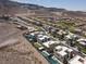 This community features desert landscaping and modern homes against a backdrop of rolling hills at 292 Crimson Edge St, Henderson, NV 89012