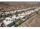 This desert community is thoughtfully designed with modern homes featuring desert landscaping and green spaces at 292 Crimson Edge St, Henderson, NV 89012