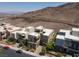 Aerial view of modern homes nestled against the mountain landscape at 292 Crimson Edge St, Henderson, NV 89012