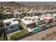 A modern, planned community featuring homes with yard and pool, set against desert landscape at 292 Crimson Edge St, Henderson, NV 89012