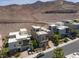Aerial view showcases homes with pools, set against the desert mountain backdrop at 292 Crimson Edge St, Henderson, NV 89012