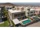 A modern home's backyard featuring a sleek pool, small yard and contemporary design at 292 Crimson Edge St, Henderson, NV 89012