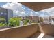Exterior balcony view featuring neighborhood street, lush landscaping, and contemporary architecture at 292 Crimson Edge St, Henderson, NV 89012