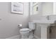Clean, modern bathroom with pedestal sink and toilet provides a simple and functional space at 292 Crimson Edge St, Henderson, NV 89012