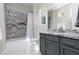 Modern bathroom with granite countertops and a shower-tub combination at 292 Crimson Edge St, Henderson, NV 89012
