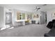 Expansive bonus room features plush carpeting and abundant natural light, ideal for a home office or entertainment area at 292 Crimson Edge St, Henderson, NV 89012