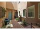 Charming courtyard showcasing a decorative water feature, seating, and lush plants, creating a peaceful ambiance at 292 Crimson Edge St, Henderson, NV 89012