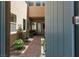 Inviting courtyard with brick pavers, lush greenery, and a tranquil seating area, enhancing the home's appeal at 292 Crimson Edge St, Henderson, NV 89012