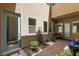 Serene courtyard featuring a bench, potted plants, and multiple windows, bringing natural light and beauty at 292 Crimson Edge St, Henderson, NV 89012