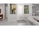 Bright entryway featuring tile floors, natural light from windows, and a modern frosted glass door at 292 Crimson Edge St, Henderson, NV 89012