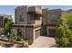 Modern two-story home featuring stone accents, two-car garage, and well-maintained landscaping at 292 Crimson Edge St, Henderson, NV 89012