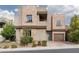 Attractive two-story home featuring stone detailing and a well-maintained front yard, offering curb appeal at 292 Crimson Edge St, Henderson, NV 89012