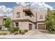 Impressive two-story home with stone accents, a well-manicured lawn, and a spacious two-car garage at 292 Crimson Edge St, Henderson, NV 89012