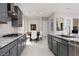 Spacious kitchen with granite countertops, modern cabinetry, and stainless steel sink at 292 Crimson Edge St, Henderson, NV 89012