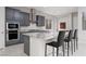 Modern kitchen with a large island, stainless steel appliances, and granite countertops at 292 Crimson Edge St, Henderson, NV 89012