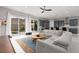 Spacious living room with view of backyard pool, modern kitchen, and mountain scenery at 292 Crimson Edge St, Henderson, NV 89012