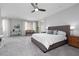 Spacious main bedroom featuring a plush bed, neutral decor, and large windows for natural light at 292 Crimson Edge St, Henderson, NV 89012