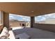 Covered outdoor space with mountain views and seating area for outdoor dining at 292 Crimson Edge St, Henderson, NV 89012