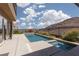 Beautiful backyard oasis featuring a sparkling pool, spa, landscaping, and mountain views at 292 Crimson Edge St, Henderson, NV 89012