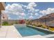 Gorgeous pool surrounded by lush landscaping, offering a serene and private backyard oasis at 292 Crimson Edge St, Henderson, NV 89012