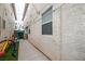 Narrow backyard featuring artificial turf, play equipment, and a walkway at 3018 Sunrise Bay Ave, North Las Vegas, NV 89031