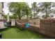Relaxing backyard with artificial turf, seating, and a charming hammock perfect for outdoor enjoyment at 3018 Sunrise Bay Ave, North Las Vegas, NV 89031