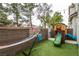 Cozy backyard featuring a playground, hammock, and low-maintenance artificial turf at 3018 Sunrise Bay Ave, North Las Vegas, NV 89031