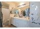 Well-lit bathroom with dual sinks, vanity, and decorative accents at 3018 Sunrise Bay Ave, North Las Vegas, NV 89031