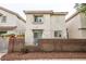 Charming two-story townhome with a private fenced yard with play equipment and lighting at 3018 Sunrise Bay Ave, North Las Vegas, NV 89031