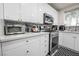 Well-equipped kitchen featuring stainless steel appliances, stylish backsplash, and plenty of countertop space at 3018 Sunrise Bay Ave, North Las Vegas, NV 89031