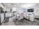 Open-concept living space with kitchen, dining area, and living room, perfect for entertaining and Gathering time at 3018 Sunrise Bay Ave, North Las Vegas, NV 89031