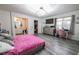 Spacious main bedroom features wood-look floors and an ensuite bathroom at 3018 Sunrise Bay Ave, North Las Vegas, NV 89031
