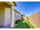 A backyard with a putting green and view of covered patio in a well landscaped yard at 3122 Berceto Ct, Henderson, NV 89044