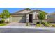 Charming single-story home with stone accents, well-manicured landscaping, and a brick driveway at 3122 Berceto Ct, Henderson, NV 89044