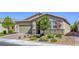 Attractive single-story house with a brick driveway, desert landscaping, and neutral-colored exterior at 3122 Berceto Ct, Henderson, NV 89044
