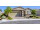 Single-story home featuring a brick driveway, desert landscaping, and a neutral color scheme at 3122 Berceto Ct, Henderson, NV 89044