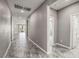 The spacious hallway is adorned with elegant tile flooring, creating a seamless transition between rooms at 3122 Berceto Ct, Henderson, NV 89044