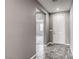 Hallway with tiled floor leading to various rooms, creating a welcoming and accessible space at 3122 Berceto Ct, Henderson, NV 89044