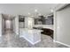 A kitchen boasts an island, granite countertops, and modern appliances at 3122 Berceto Ct, Henderson, NV 89044